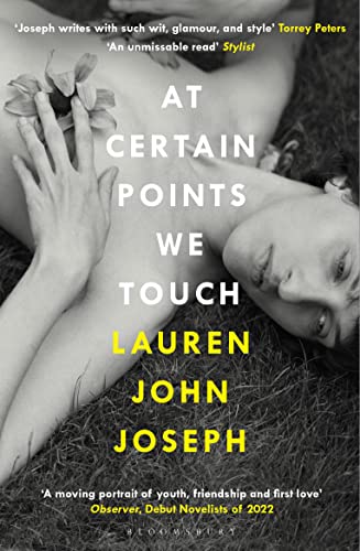 A person lies in grass, holding a flower to their chest, with book title text.