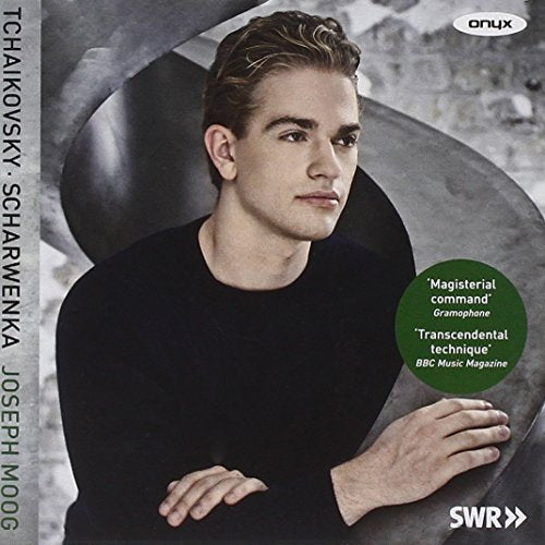 CD cover featuring pianist Joseph Moog in a dark studio setting.
