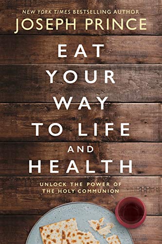 Book cover with title Eat Your Way to Life and Health on wooden background.
