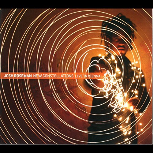 Album cover with spiral light design and red text on a dark background.