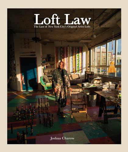 A book cover with a man standing in a colorful artist's loft interior.