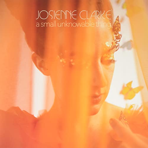 Album cover for Josienne Clarke featuring a woman with butterflies.