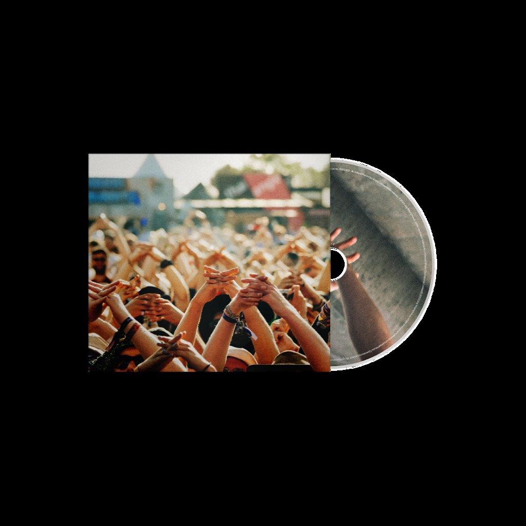 CD case with a crowd of raised hands at a concert.