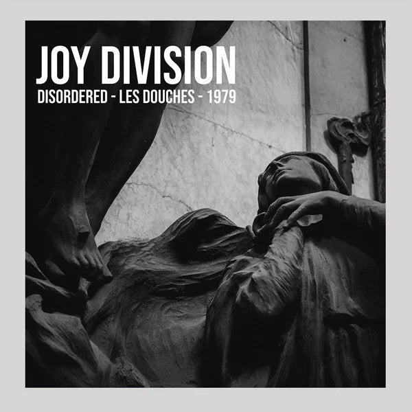 Joy Division album cover: black and white photo of sculpted figures.