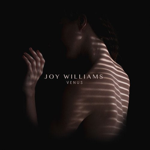 CD cover featuring a person's silhouette with light stripes across their back and shoulder.