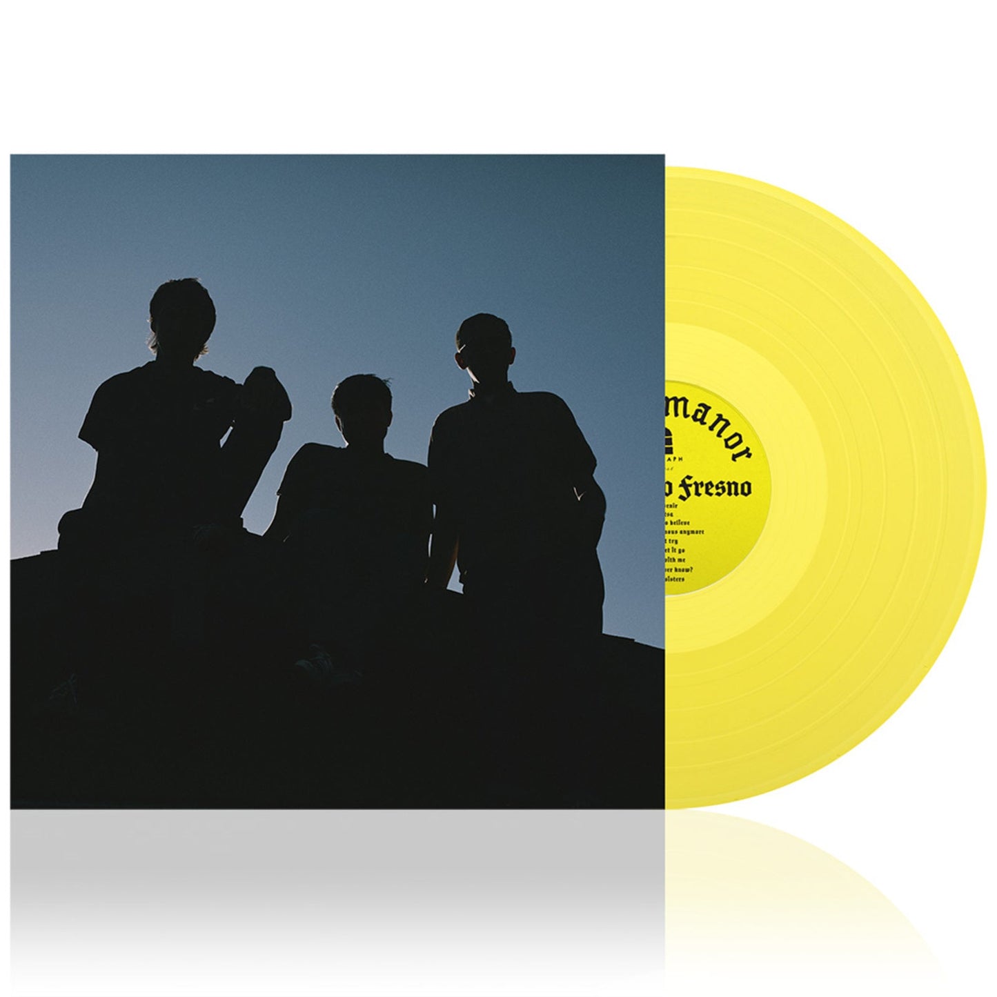 Yellow vinyl record next to album cover featuring silhouettes of three people.