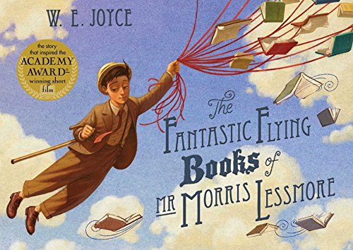 A man in a suit floats in the sky holding red strings attached to books.