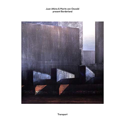 Album cover: Abstract, dark architectural shapes with a hazy sky.