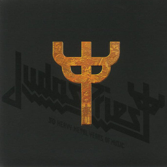 Black background with a gold Judas Priest trident logo featuring intricate embossed imagery.