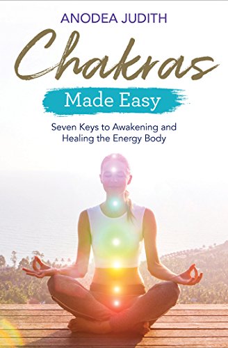 Book cover: woman meditating with colorful chakra energy centers.