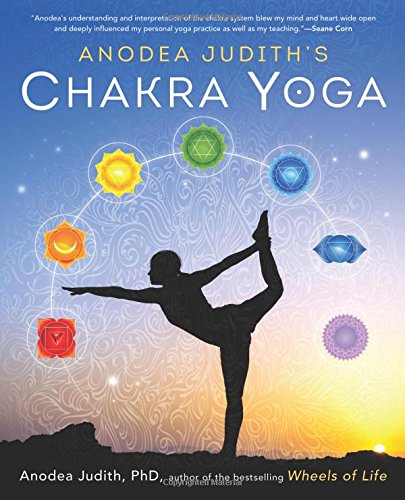 "Book cover with a silhouette of a person in a yoga pose surrounded by chakra symbols."