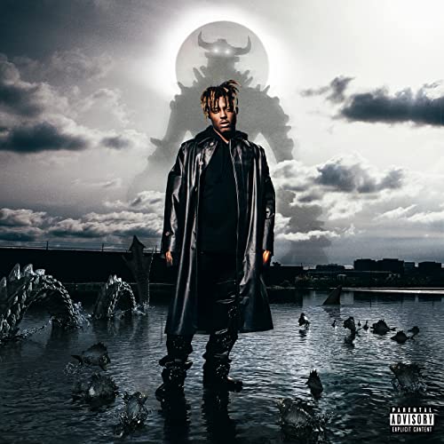 Juice WRLD stands in water before a giant horned monster silhouette against a cloudy sky.
