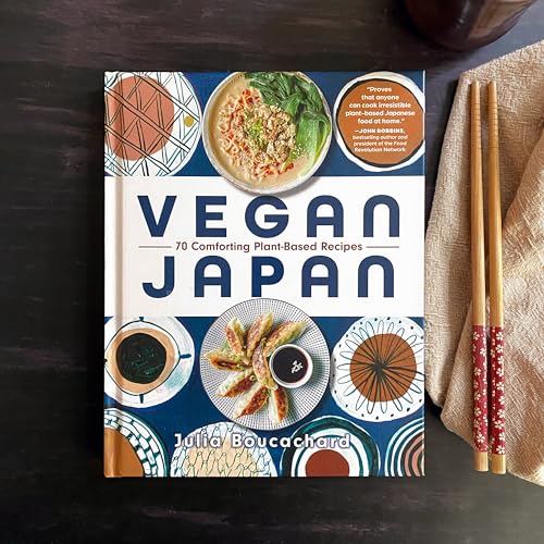 Cookbook "Vegan Japan" with food photos, chopsticks, and patterned plates.