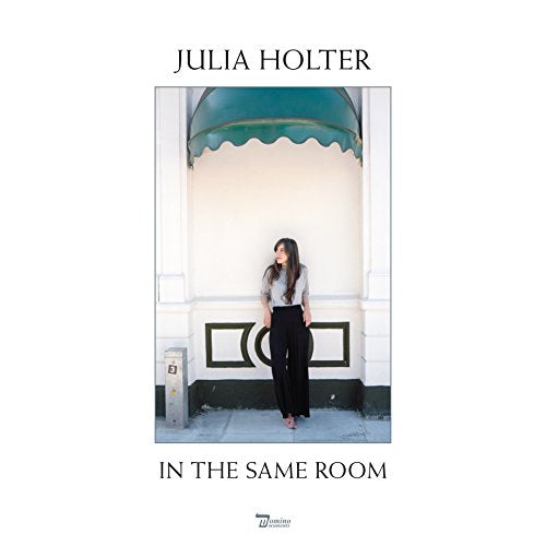 Album cover with Julia Holter standing in front of a white building.