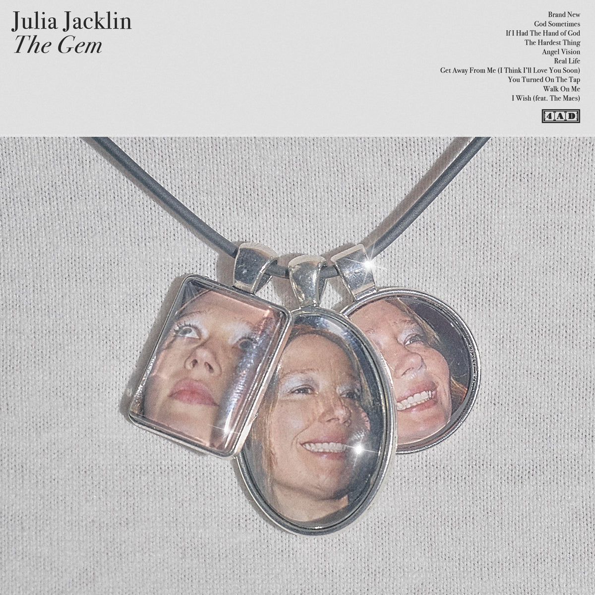 Album cover for Julia Jacklin’s “The Gem” featuring a silver locket with a face inside.