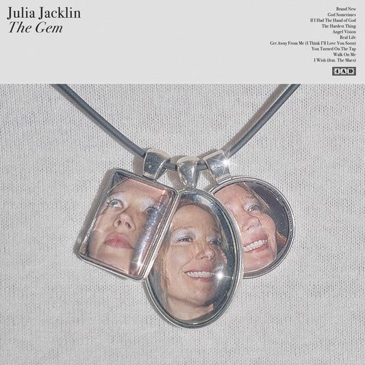 Album cover for Julia Jacklin’s “The Gem” featuring a silver locket with a face inside.