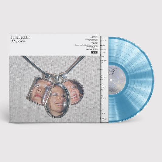 Vinyl record cover featuring three photo pendants and a translucent turquoise vinyl disc.