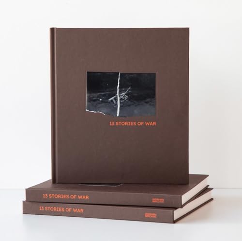 Stack of three brown books titled “13 Stories of War” with a cracked image.
