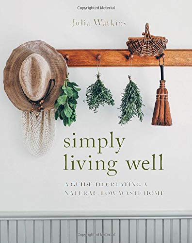 Book cover showing a hat, herbs, and a whisk hanging on a wooden rack.
