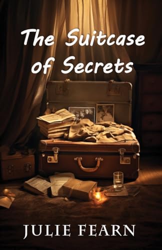 Vintage suitcase with books, photos, and a glass, lit by candlelight.