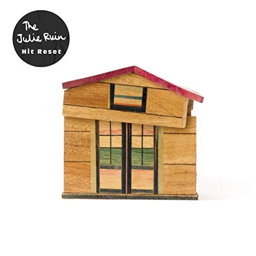 The Julie Ruin "Hit Reset" vinyl album cover featuring a wooden house.