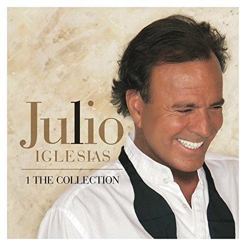 "Julio Iglesias CD cover featuring a smiling man with dark hair and white shirt."
