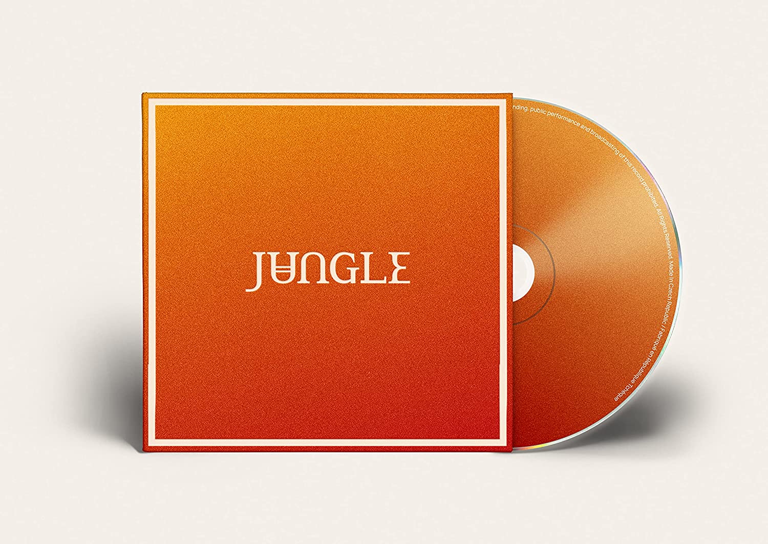 CD case with orange and red geometric design, labeled "Jungle.