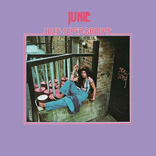 A woman sits on a ledge near a stage door on this album cover.