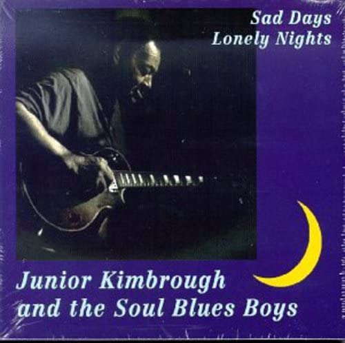 CD cover: Junior Kimbrough playing guitar, dark background, yellow crescent moon.