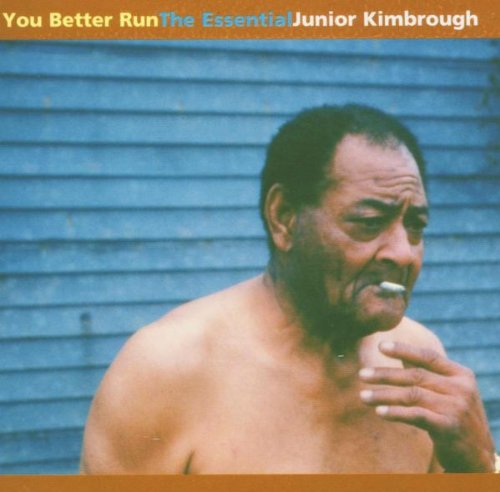 Album cover featuring a shirtless man against a blue wall, with text at the top.