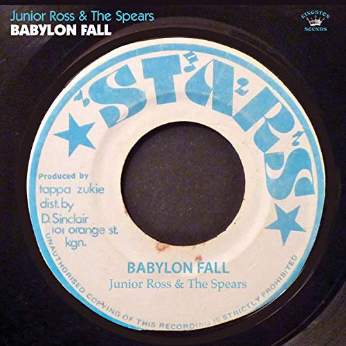 Vinyl record label with blue stars and text: "Babylon Fall" by Junior Ross.