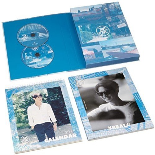 Open CD case with two discs, a 2016 calendar, and a photo book.