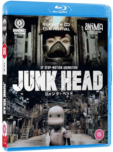 Blu-ray cover for the stop-motion film Junk Head featuring a mechanical character and industrial setting.