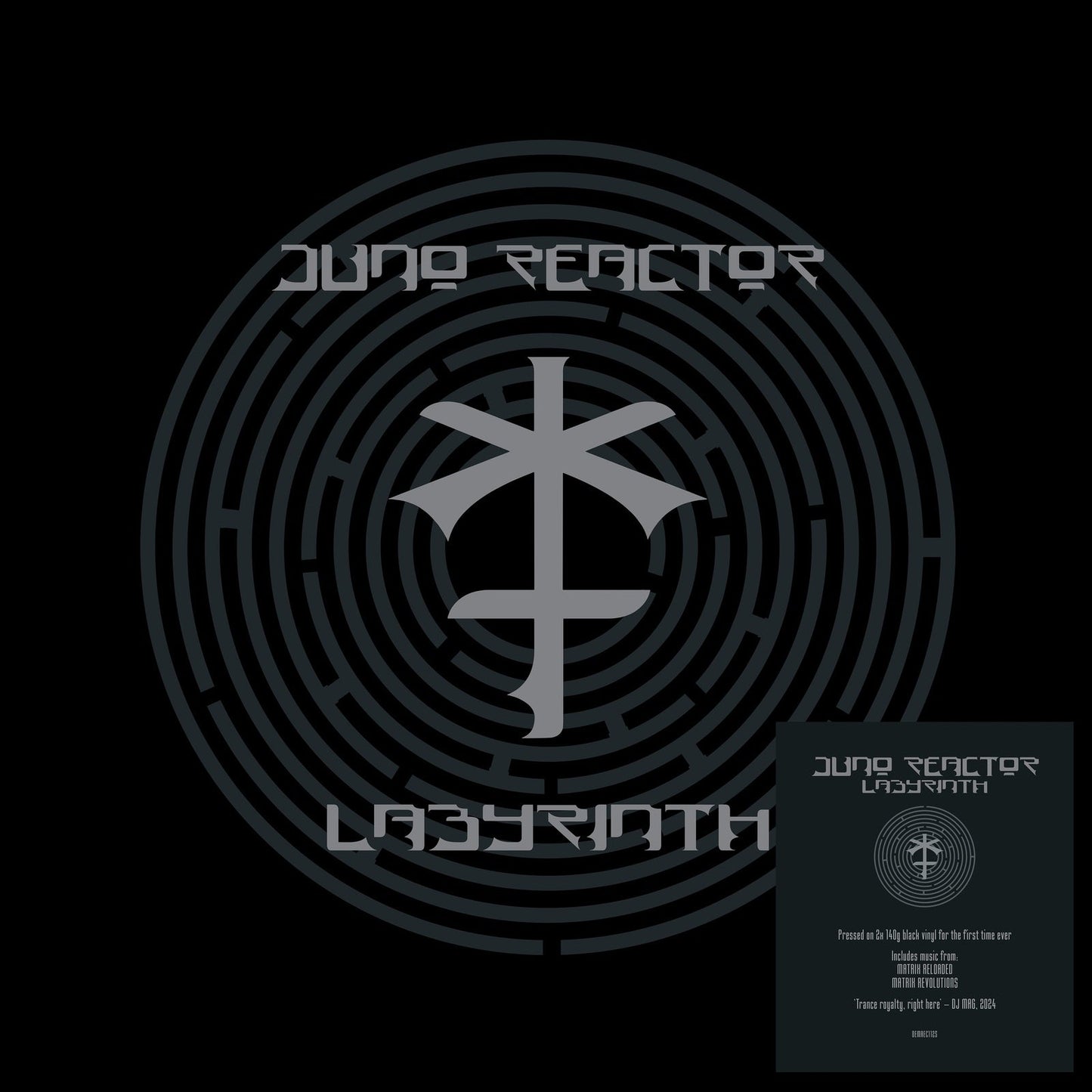 Black vinyl record cover with concentric circles and a central, stylized symbol.