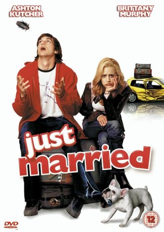 Man and woman on suitcase with dog and car behind them on DVD cover.