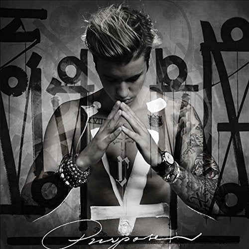 Black and white album cover featuring Justin Bieber with tattoos and hands clasped.