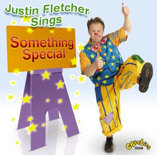 Justin Fletcher in colorful clothes giving two thumbs up, CD cover.