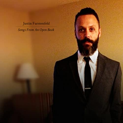 CD cover featuring Justin Furstenfeld in a suit, looking directly at the viewer.