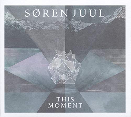 Album cover featuring a geometric crystal shape over a landscape of mountains and water.