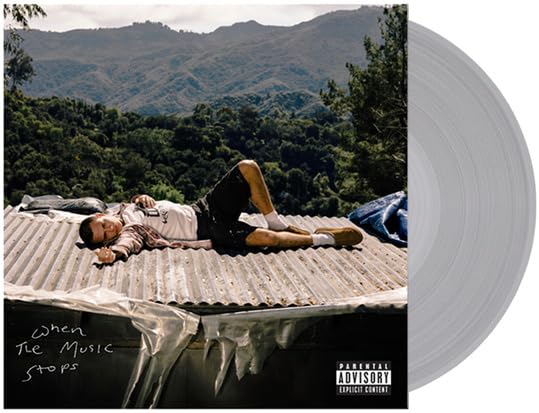 jxdn album cover with a person lying on a corrugated metal roof.