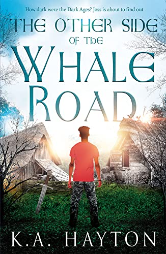 Book cover: a young man stands before a village in twilight.