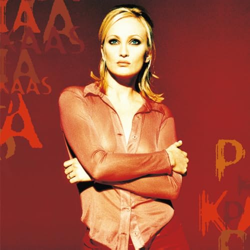 Patricia Kaas portrait on a red album cover with repeating text.
