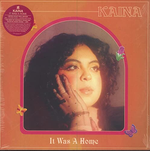Vinyl album cover featuring a portrait of a woman with butterflies and flowers.