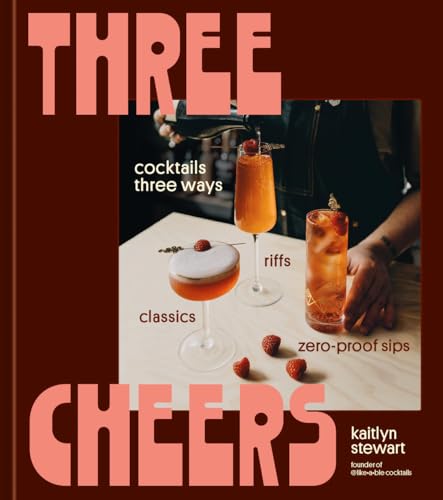 Book cover with cocktails, fruit, and bold red text reading “Three Cheers.”