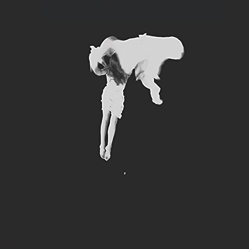 Black and white album cover featuring a distorted figure with long legs.
