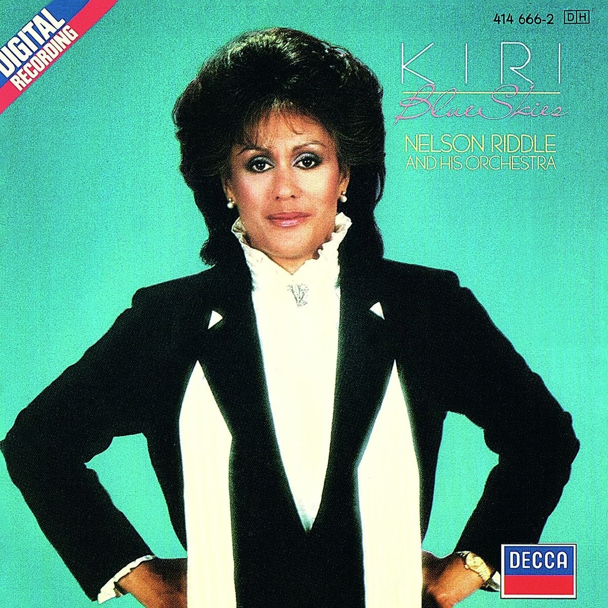 CD cover featuring Kirite, a woman in a black suit, smiling.