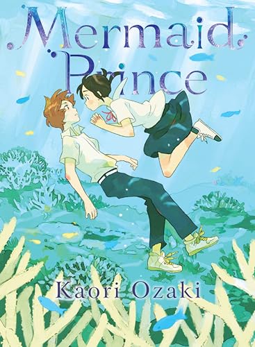 Two young people in school uniforms float underwater amidst coral.