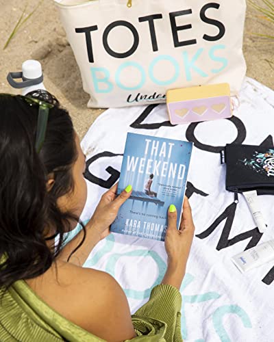 Book cover, “That Weekend” by Kara Thomas, on a beach towel.