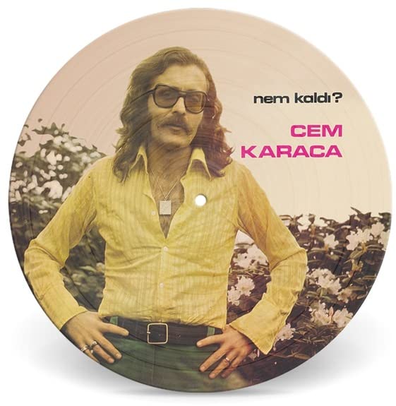 Vinyl record featuring portrait of Cem Karaca in yellow shirt.