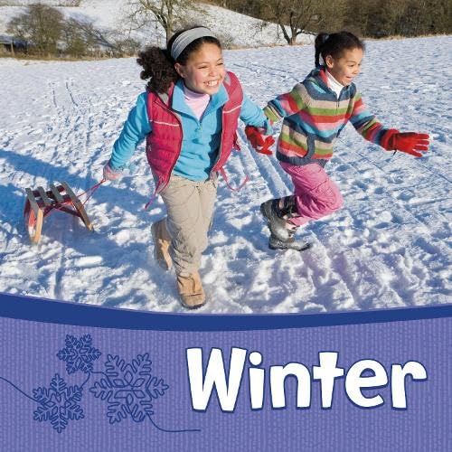 Two happy children running through the snow with a wooden sled nearby.